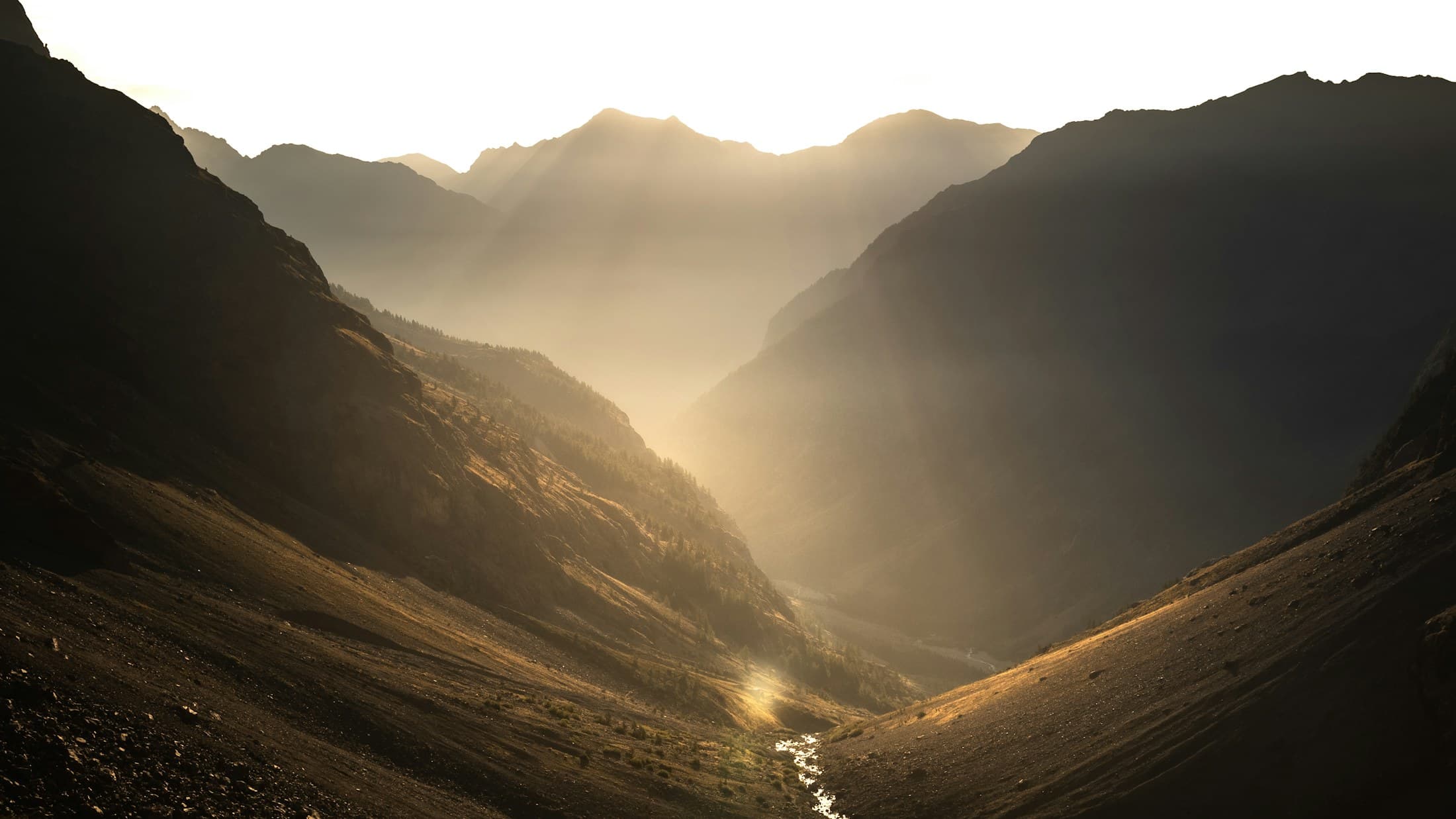 Golden morning light over a mountain valley